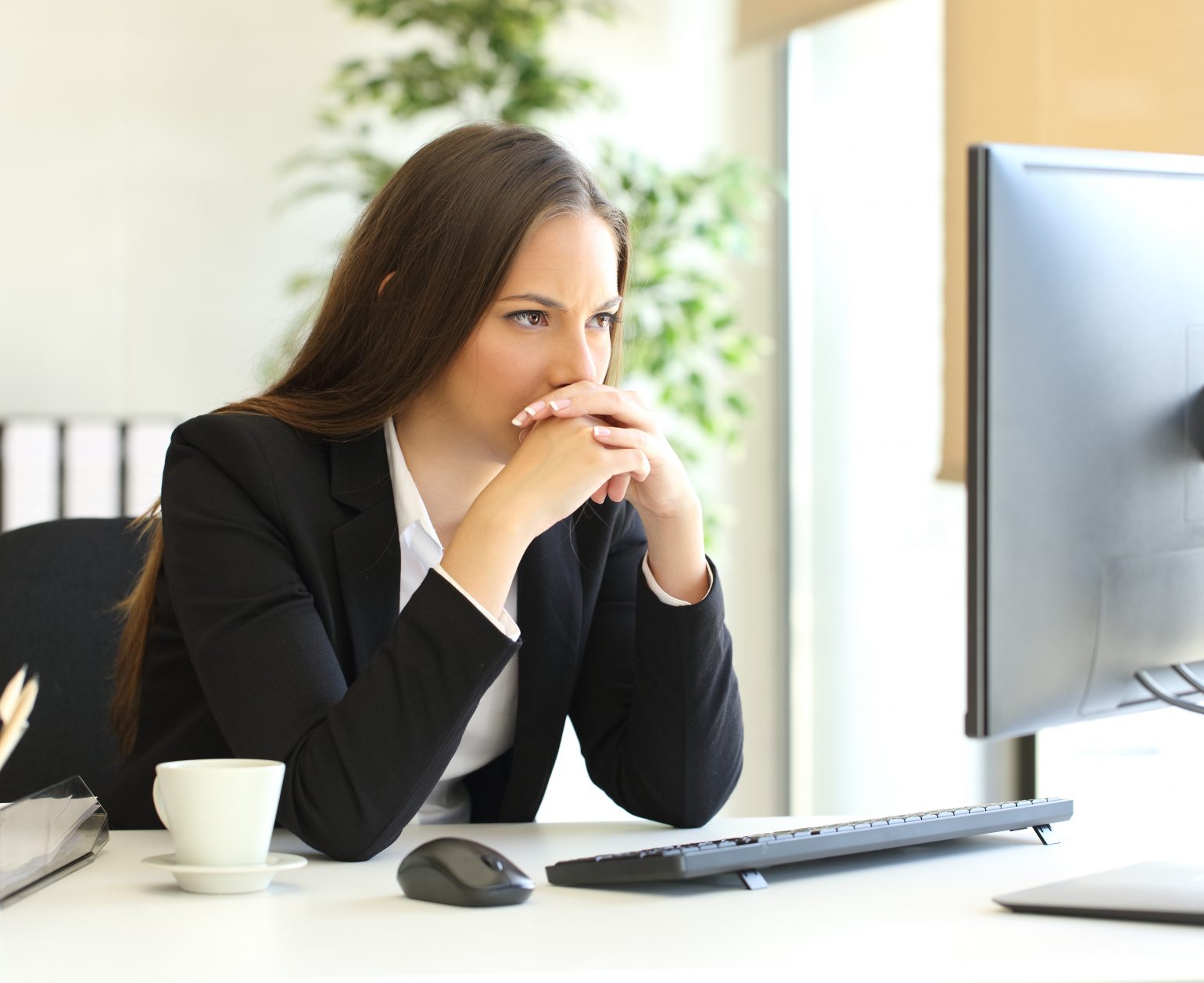 woman looks at computer