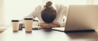 woman with head on the desk