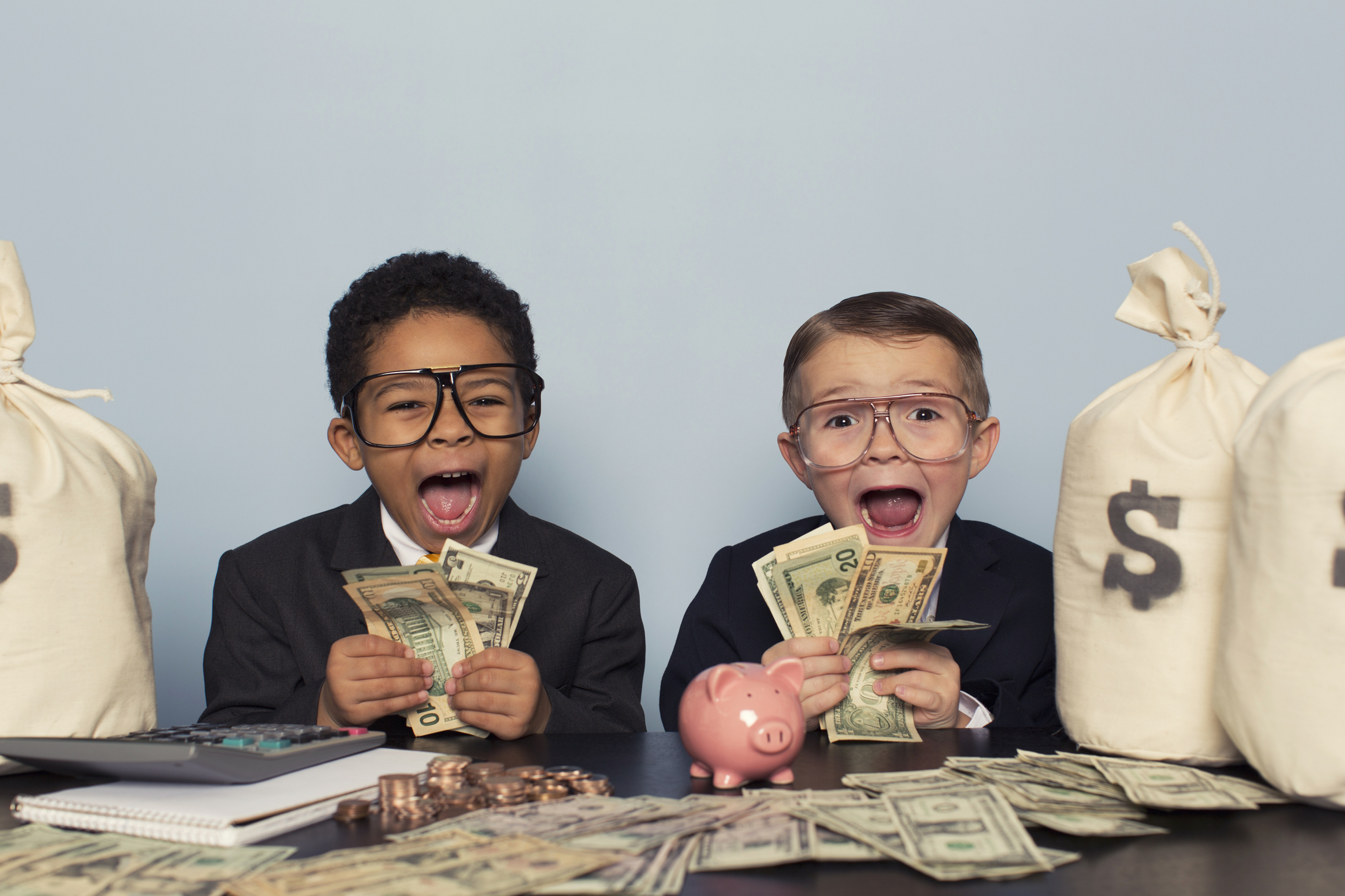 A couple of young businessmen are astounded by the profits coming in.