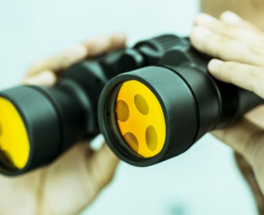 A person looking through binoculars