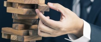 businessman playing jenga