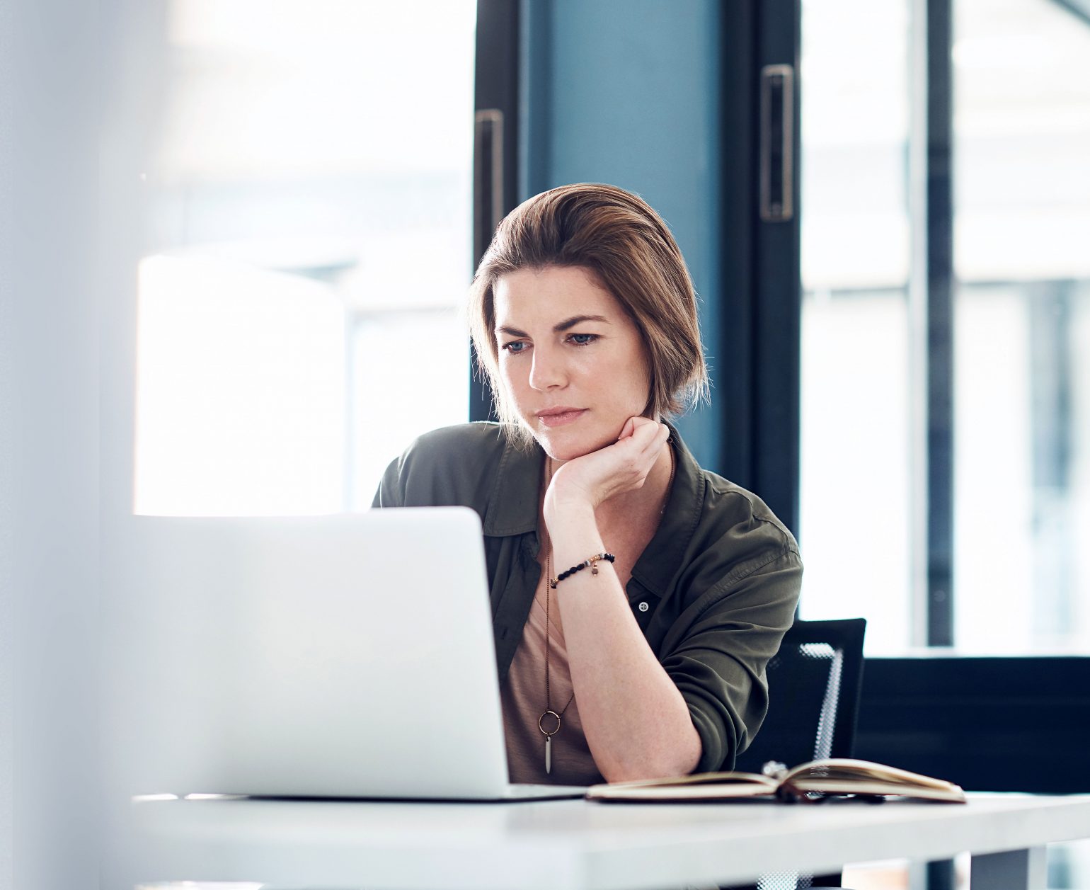 woman concentrating on a laptop screen