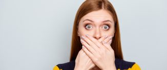 Hush scared business people coughing big pop-eyed fashion concept. Close up portrait of pretty cute terrified frightened mute dumb silent manager model with palms over mouth isolated gray background