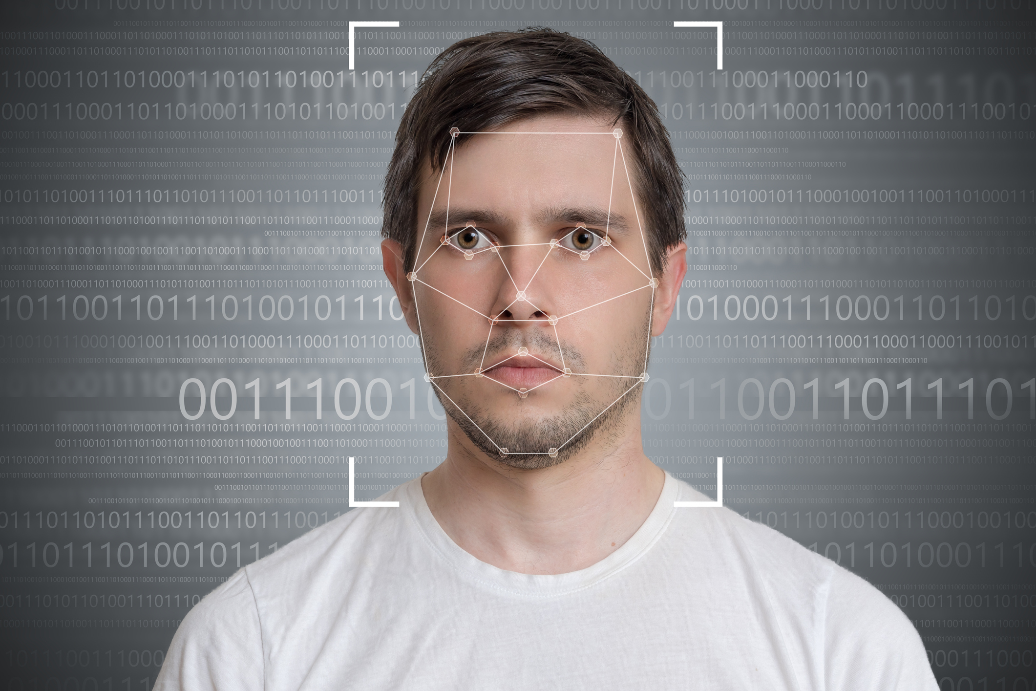 Face detection and recognition of man. Computer vision concept. Binary code in background.