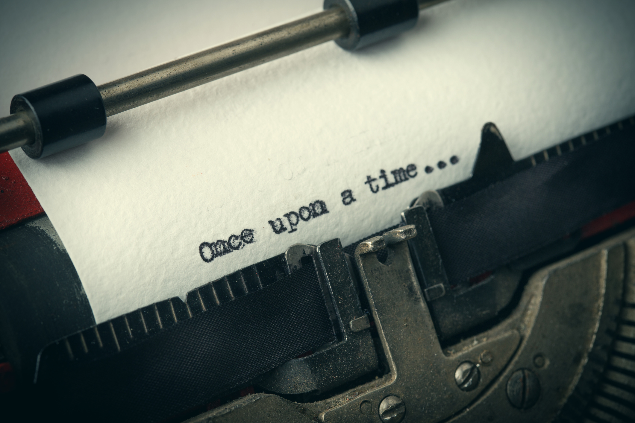 Close up of old typewriter covered with dust with Once upon a time text