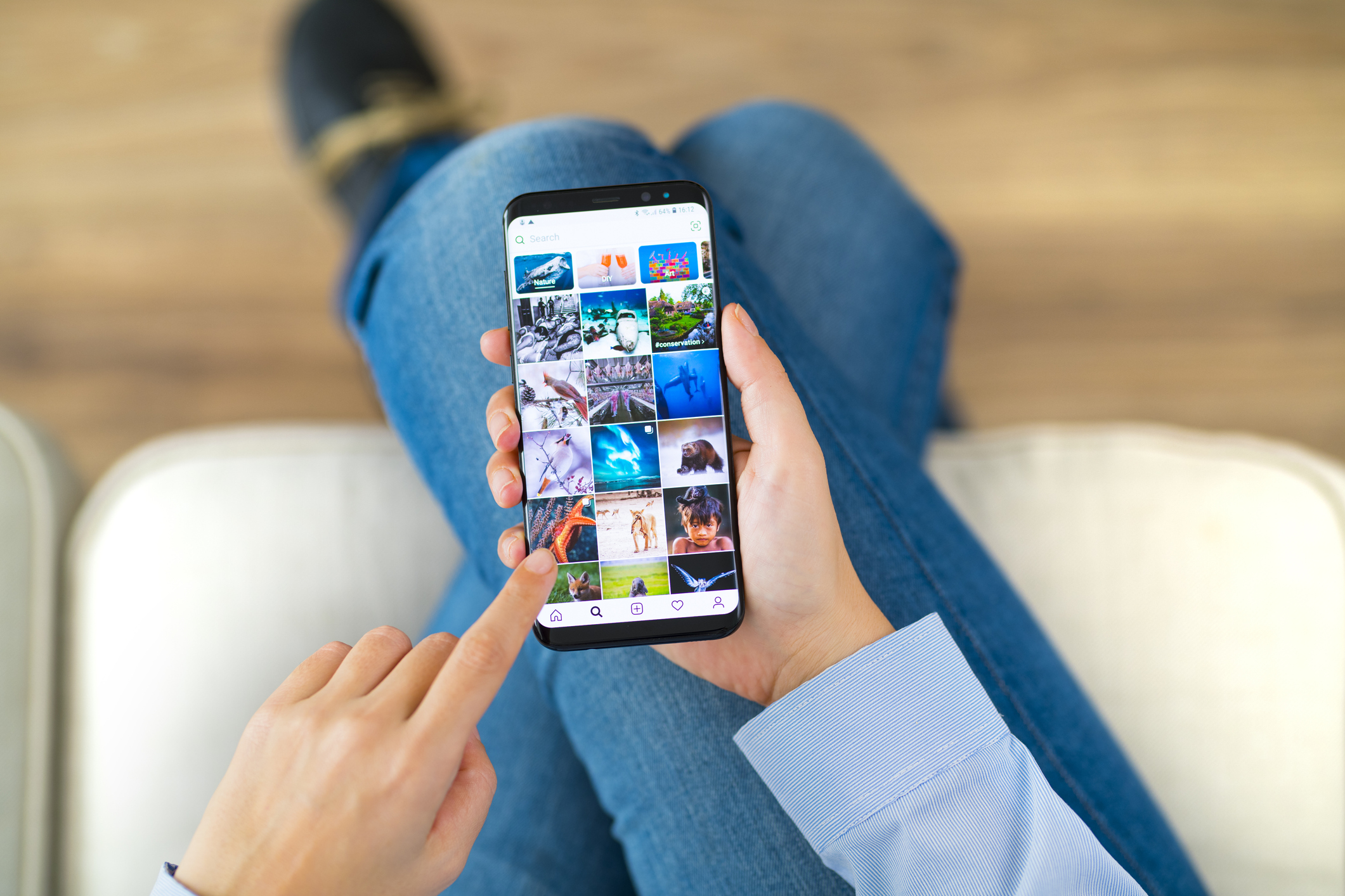 Woman looking at social media on her phone.