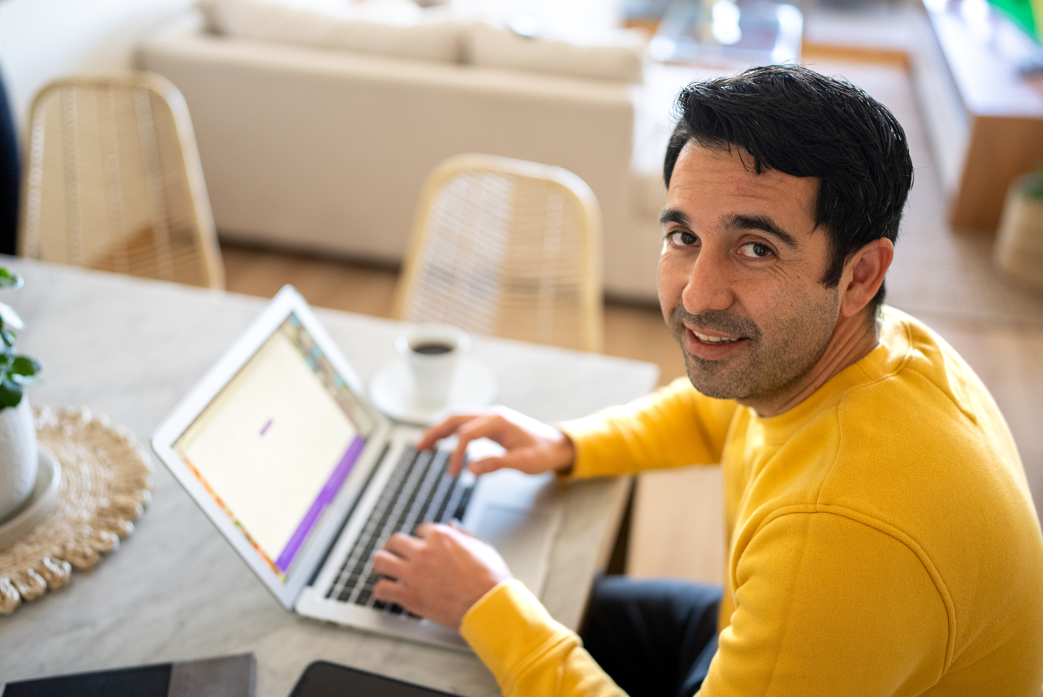 Portrait of a mid adult man using the laptop at home