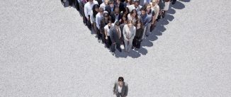 Businesswoman at apex of crowd